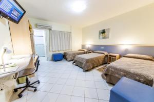 Postel nebo postele na pokoji v ubytování Asppen Hotel + 29 fotografií
