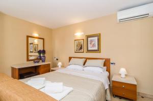 Postel nebo postele na pokoji v ubytování Studio apartment Antica