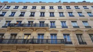 a facade of a building with balconies at La Suite Terreaux in Lyon