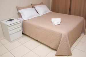 Postel nebo postele na pokoji v ubytování Flat Beira Rio