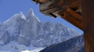 a view of a snow covered mountain from a cabin at LES 3 CIMES BLANCHES in Chamonix