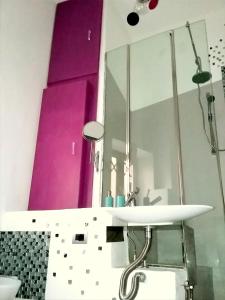 a bathroom with a sink and a mirror at La casa di Adele in Syracuse +66 photos