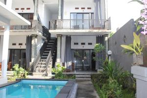 an external view of a house with a swimming pool at D Jana in Amed