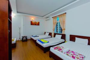 Postel nebo postele na pokoji v ubytování Mango Garden Hoi An Homestay