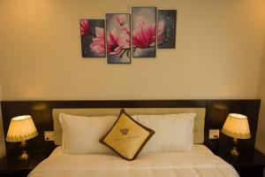 Postel nebo postele na pokoji v ubytování Sapa Wings Hotel