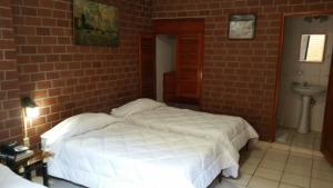 Postel nebo postele na pokoji v ubytování Hotel Rex