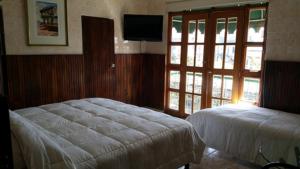 Postel nebo postele na pokoji v ubytování Hotel Rex