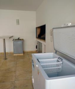 a kitchen with a sink and a dishwasher at El Dorado San Juan in San Juan