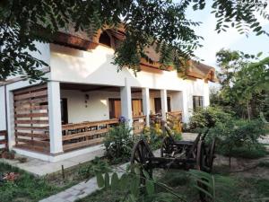 a house with a garden in front of it at Casa de vacanta Spiritul Deltei in Sfântu Gheorghe
