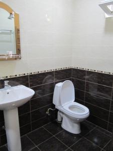 a bathroom with a toilet and a sink at B&B Byurakan-Vanush in Byurakan