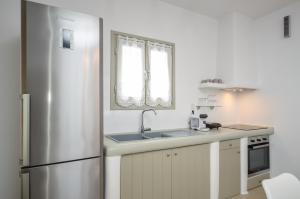 Kuchyňa alebo kuchynka v ubytovaní Aphrodite Luxury Apartments