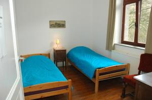 Cama o camas de una habitación en Maison de la Vallee
