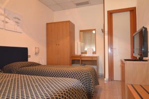 TV a/nebo společenská místnost v ubytování Hotel Magnolia
