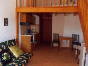 a living room with a couch and a kitchen at George SkyrosStudios in Skiros +54 photos