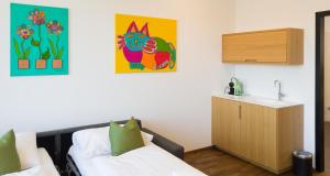 Posteľ alebo postele v izbe v ubytovaní Business Motel Feldkirch