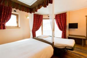Posteľ alebo postele v izbe v ubytovaní Hotel Pontiglia
