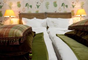 A bed or beds in a room at Eriksberg Hotel & Nature Reserve