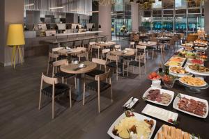 a buffet table with many different types of food at Melia Barcelona Sky 4* Sup in Barcelona