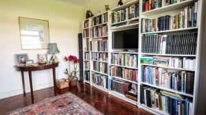 a living room with book shelves filled with books at Marvene in Thornaby on Tees