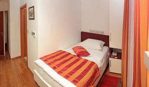 Postel nebo postele na pokoji v ubytování Hotel Monika