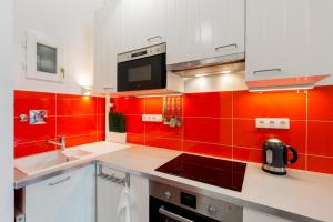 Kuchyňa alebo kuchynka v ubytovaní F4 Fiumei Apartment