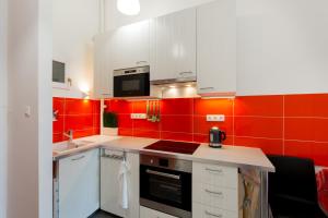 Kuchyňa alebo kuchynka v ubytovaní F4 Fiumei Apartment