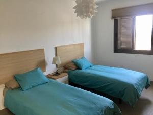Postel nebo postele na pokoji v ubytování Villas Las Maretas