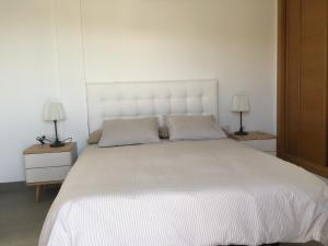 Postel nebo postele na pokoji v ubytování Villas Las Maretas