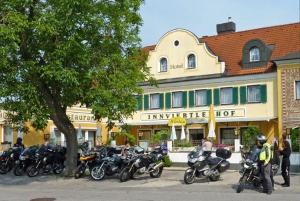 a group of motorcycles parked in front of a building at Innviertlerhof in Linz
