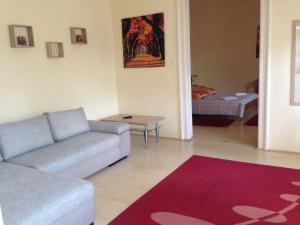 A bed or beds in a room at Péterfia Apartman Még 4 kép