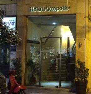 a building with a hotel akropyps sign on the door at Hotel Acropolis in Kavála