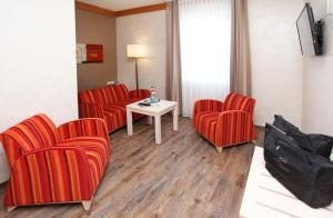 TV a/nebo společenská místnost v ubytování Posthotel Usseln
