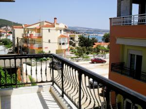 a balcony with a view of a city at Studios Elena in Limenaria