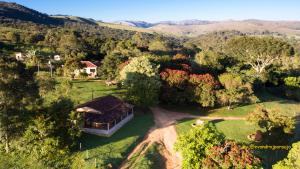 an aerial view of a house in the middle of a forest at Pousada Velho Chico in Vargem Bonita