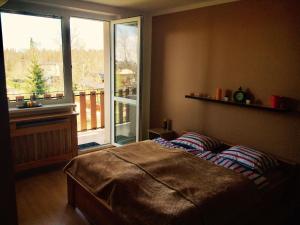 Posteľ alebo postele v izbe v ubytovaní Apartman Tatranska Lomnica