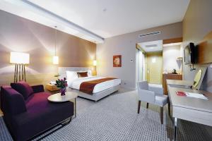 Ramada by Wyndham Podgorica客房内的一张或多张床位