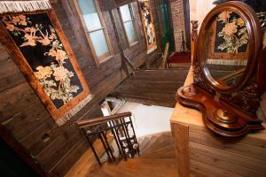 a mirror sitting on a table next to a chair at Baderhaus in Bruck an der Mur
