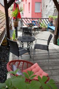 a group of chairs and tables on a patio at Baderhaus in Bruck an der Mur