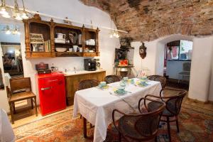 a kitchen with a table and a red refrigerator at Baderhaus in Bruck an der Mur