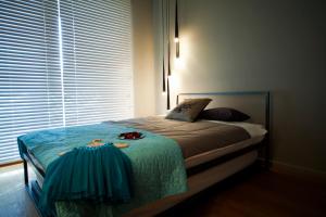 Posteľ alebo postele v izbe v ubytovaní Apartament Wśród Drzew