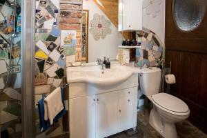 a bathroom with a sink and a toilet at Baderhaus in Bruck an der Mur