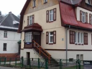 a large house with a red roof and a staircase at Na Prusa in Szklarska Poręba