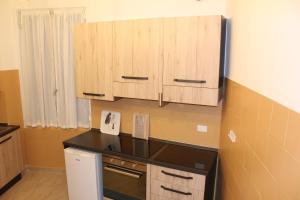 Eldhús eða eldhúskrókur á Home Genoa Hostel