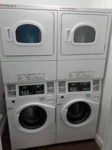 three washing machines stacked on top of each other at Hotel Sunrise in San Francisco