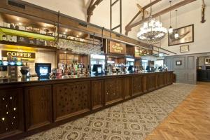 a bar in a restaurant with a long row of cabinets at The Golden Hope Wetherspoon in Sittingbourne