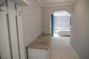 a bathroom with a sink and a bedroom with a bed at Casa Meyra in Jupiter +97 photos