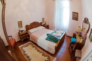 a bedroom with a bed and a mirror at Athens Quinta in Athens