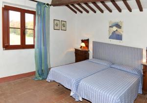 Postel nebo postele na pokoji v ubytování Agriturismo Tenuta Vallelunga