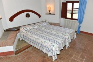 Postel nebo postele na pokoji v ubytování Agriturismo Tenuta Vallelunga