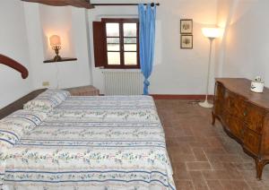 Postel nebo postele na pokoji v ubytování Agriturismo Tenuta Vallelunga